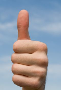 Thumbs up on a blue sky background