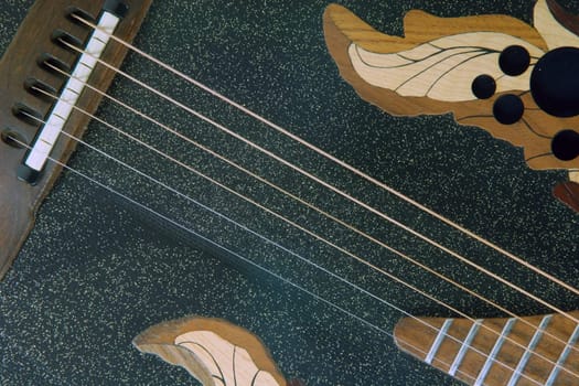 black guitar and strings detail music equipment