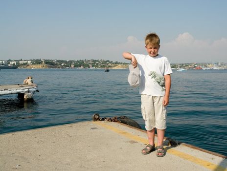 Portrait of a boy with sea at background