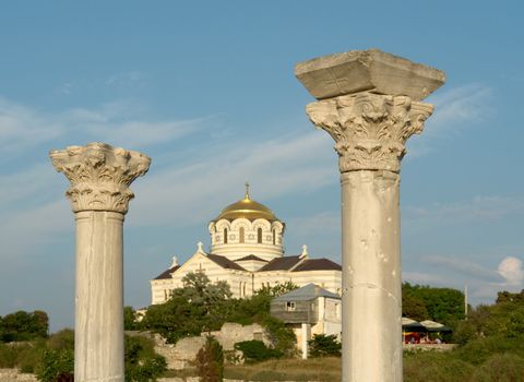 Chersonesos. Ancient Greek columns with orthodox temple at background