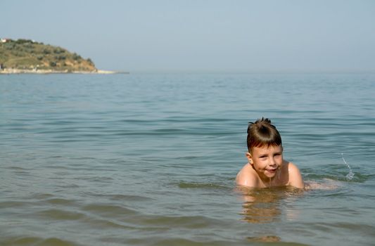 summer days. little boy on the beach
