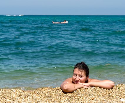 Summer Days. Beautiful Young Woman on the Beach.