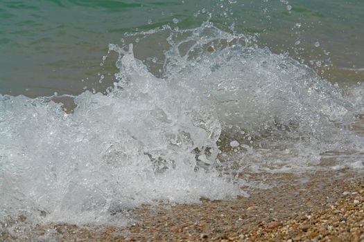 Sea surf. The wave breaks about coast.