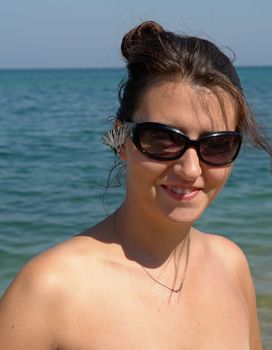 Summer Days. Beautiful Young Woman on the Beach.
