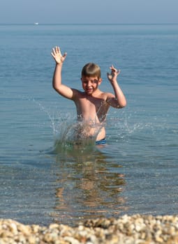 summer days. little boy on the beach