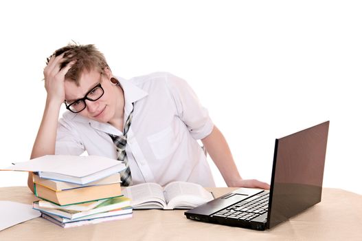 frustrated student sits behind a desk isolated on white background