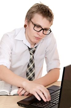 a male student works on the laptop isolated on white background