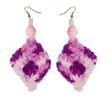 Crocheted earrings on a white background. Handmade. �ollage