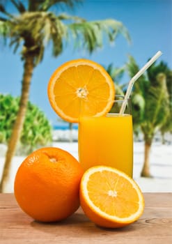 orange juice in a glass on a table with oranges