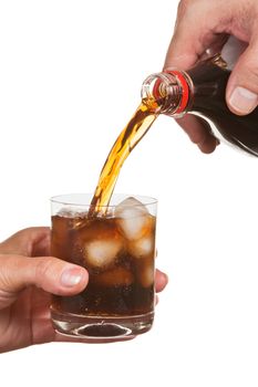 pouring soda into a glass isolated on white background