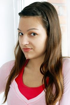 self confident caucasian teenage girl portrait indoors