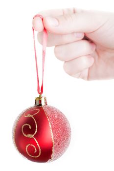 Human hand holding christmas ornament decoration