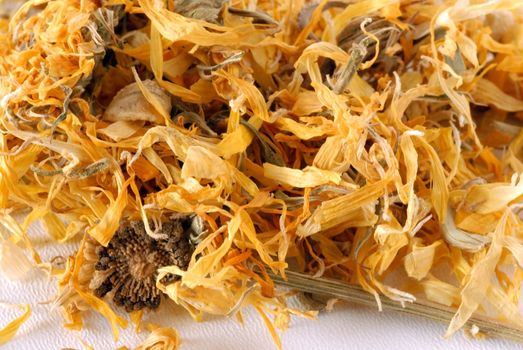 heap of dried marigold for herbal tea