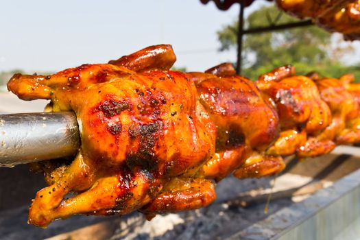 Image of delicious roasted chicken on the spit