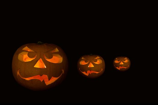 ghastly halloween pumpkin on black background