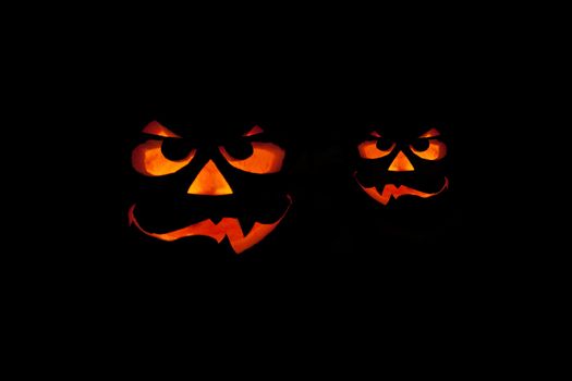 ghastly halloween pumpkin on black background