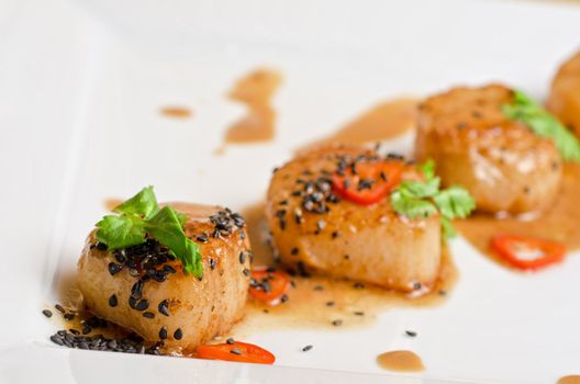 Close up Scallop seafood appetizer with spices