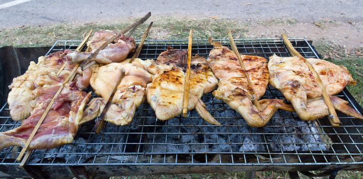 Roasting chicken on the chargrill