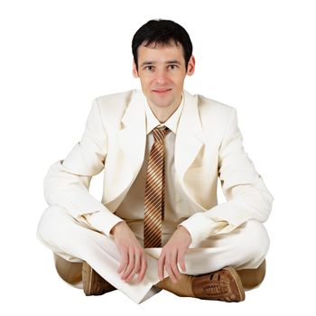 Young business man sitting on a white background