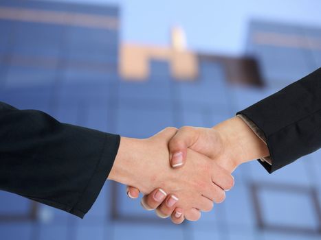 Handshake Handshaking and blured building in background