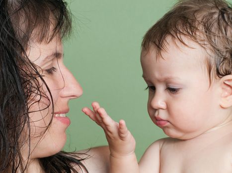 Smiling mother and little child - family happiness