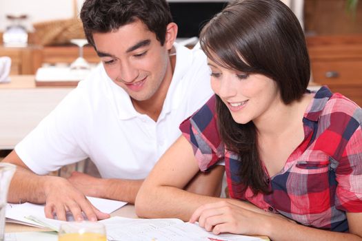 Young couple looking at documents together