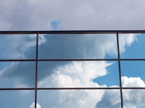 Blue sky and cloud reflection in building outdoors