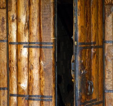 Old church opened entrance with wood door and lock