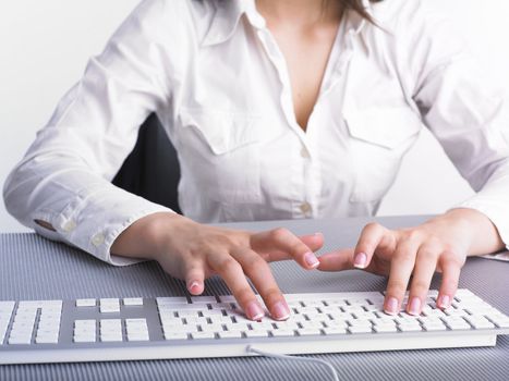 Business Secretary Typing on Computer Keyboard