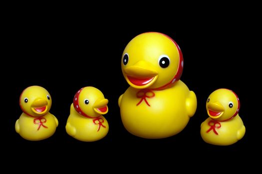 Yellow rubber mother duck toy and child isolated