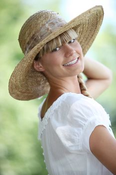 Woman smiling with straw hat