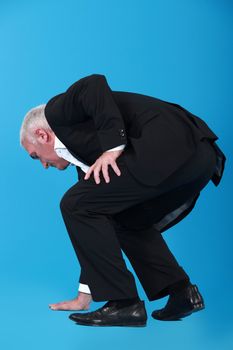 businessman touching the floor