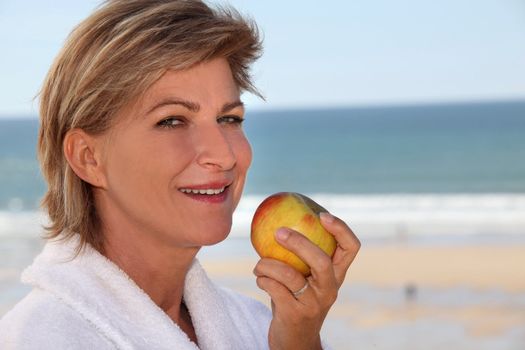 Woman eating an apple