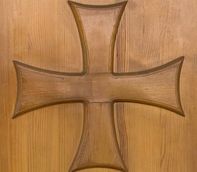 Old wood church door with religion cross