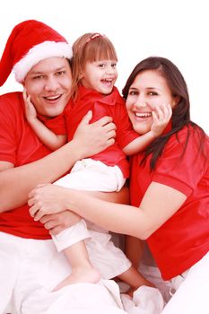 Portrait of happy family looking at camera and prepared for Christmas