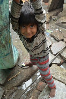 New Delhi,India-February 4, 2013:An unidentified child lives in the slums of New Delhi. 50% of the population of New Delhi is thought to live in slums,on February 4,2013 in New Delhi