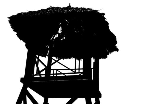 Silhouette view of tropical beach watchtower
