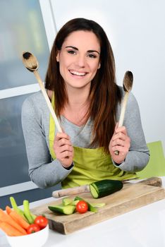 Young Woman Cooking. Healthy Food - Vegetable Salad. Diet. Dieting Concept. Healthy Lifestyle. Cooking At Home. Prepare Food 