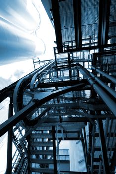 industrial ladders, cables, pipelines in blue tones