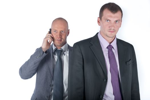 The businessman and the bodyguard with a pistol