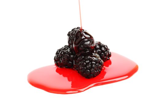 blackberry pile in syrup isolated on white