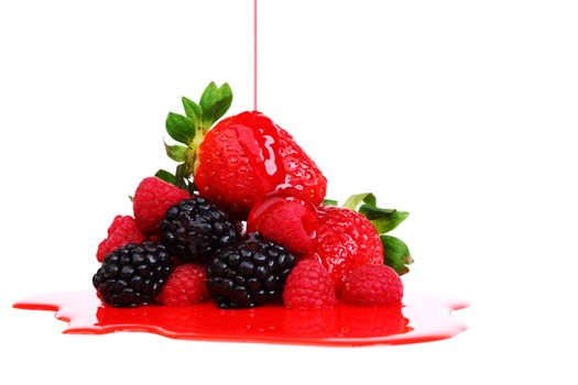 big berry pile in syrup isolated on white