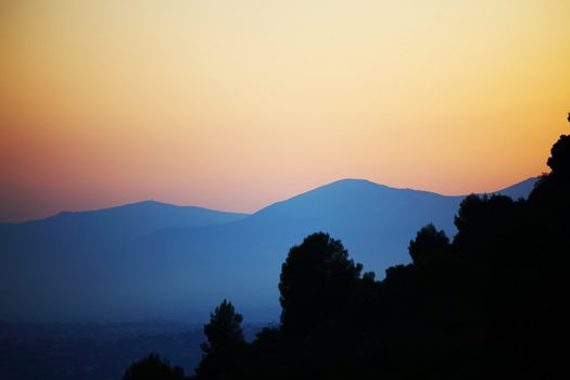 sunset mountains yellow sky