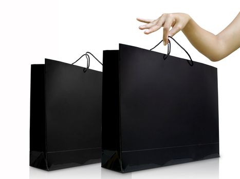 Lady hand pick the black shiny shopping bag, Shopping concept