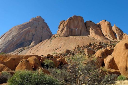 Spitzkoppe with sandstone boulders in the foreground, Namibia 