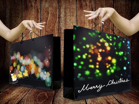 Lady hand pick up Shopping bag from wooden display, Christmas gift concept