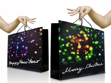 Girl hand pick up the holiday shopping bag with glossy background