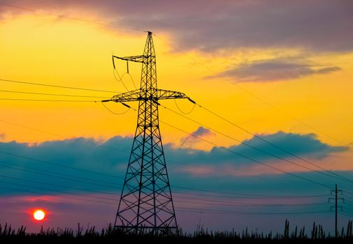 High voltage tower  on a background of the sunset