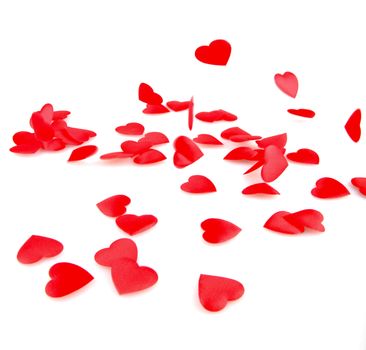 Red hearts confetti on white background
