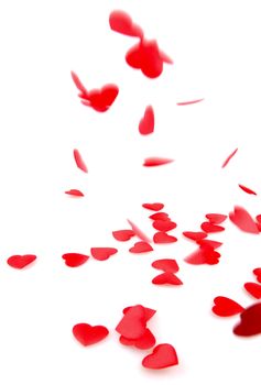 Red hearts confetti on white background